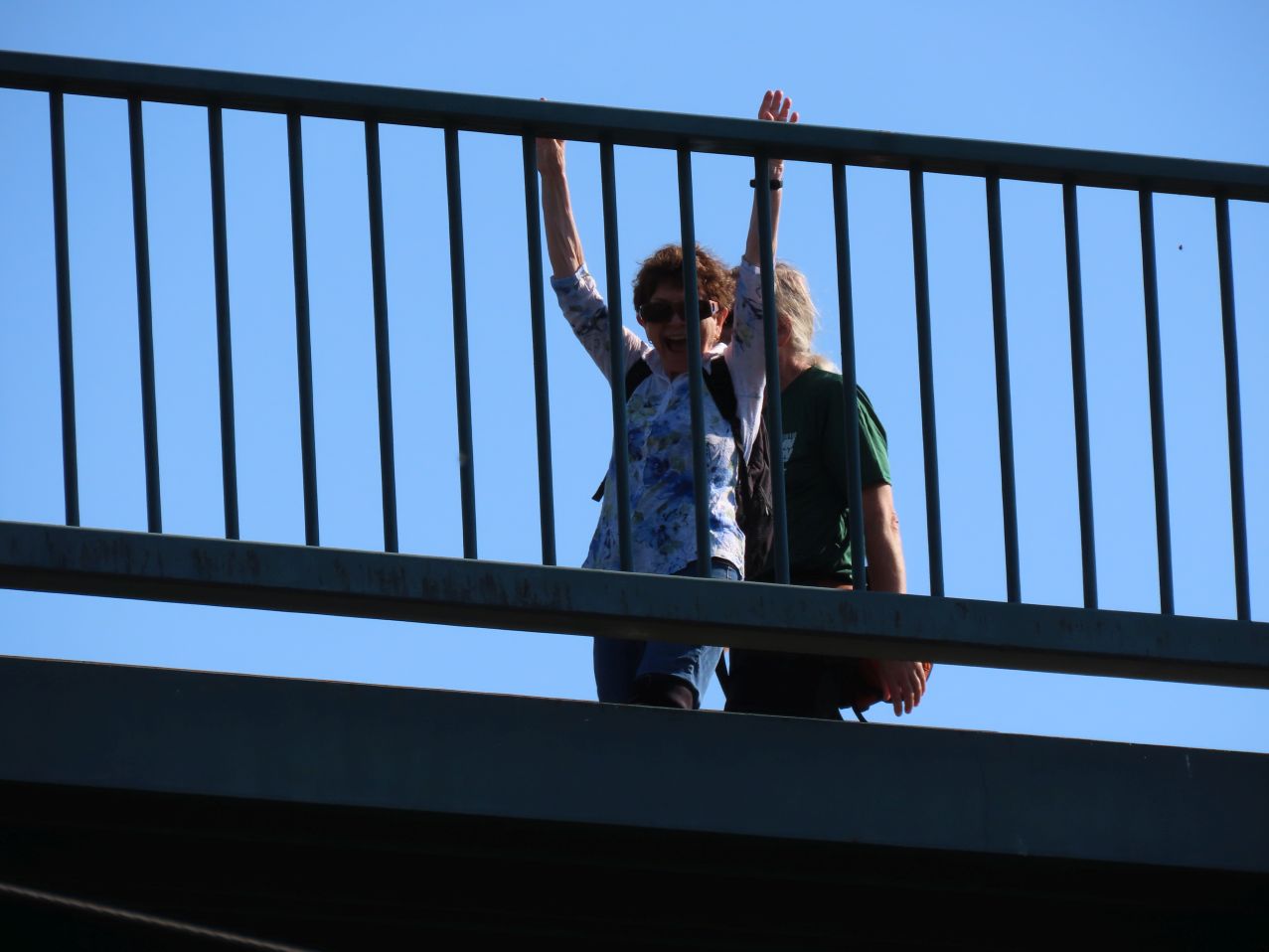 Liz beckons from bridge