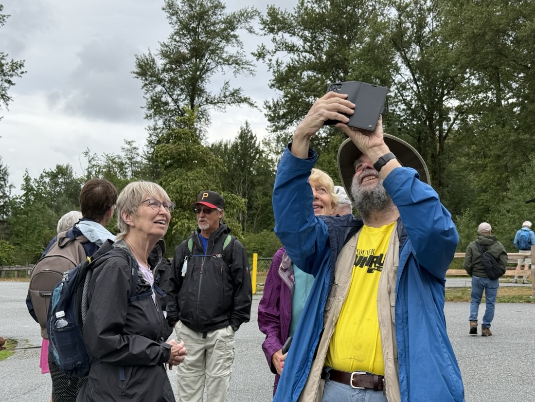 Jon, possibly photographing something